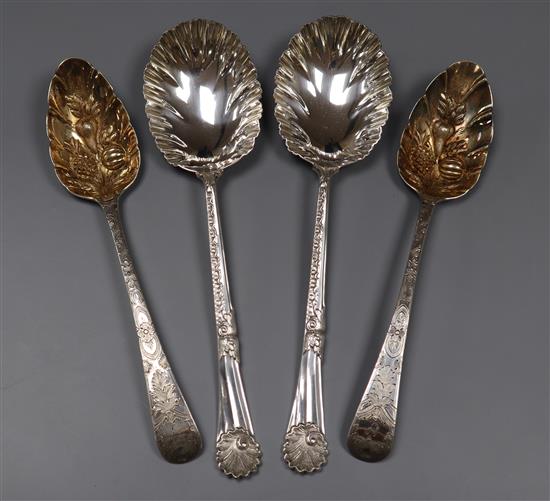 Two George III silver berry spoons and a later pair of ornate silver serving spoons by Walker & Hall, Sheffield, 1902.